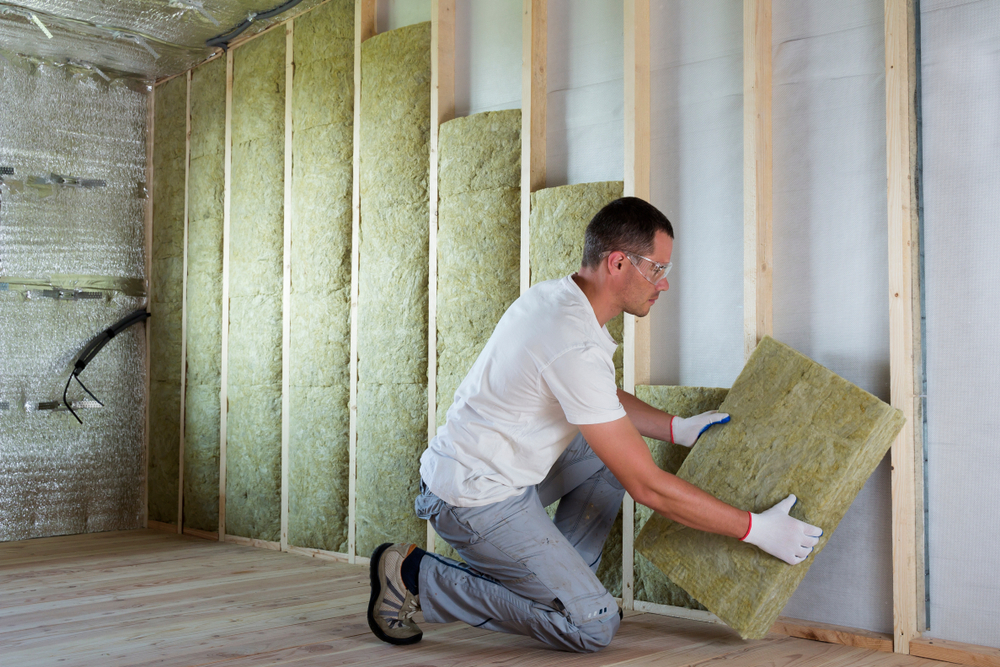 Installing insulation before the drywall